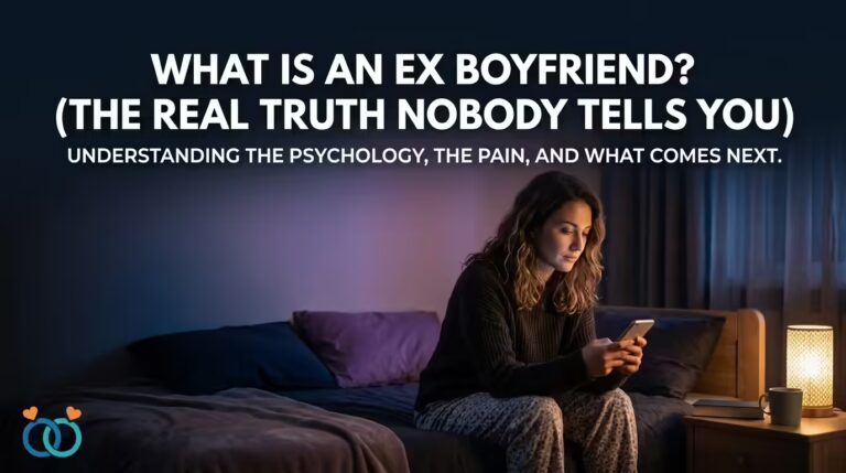 A woman sitting alone on her bed at night, looking at her phone with an expression of longing and quiet strength — illustrating the emotional complexity of understanding what an ex boyfriend really means